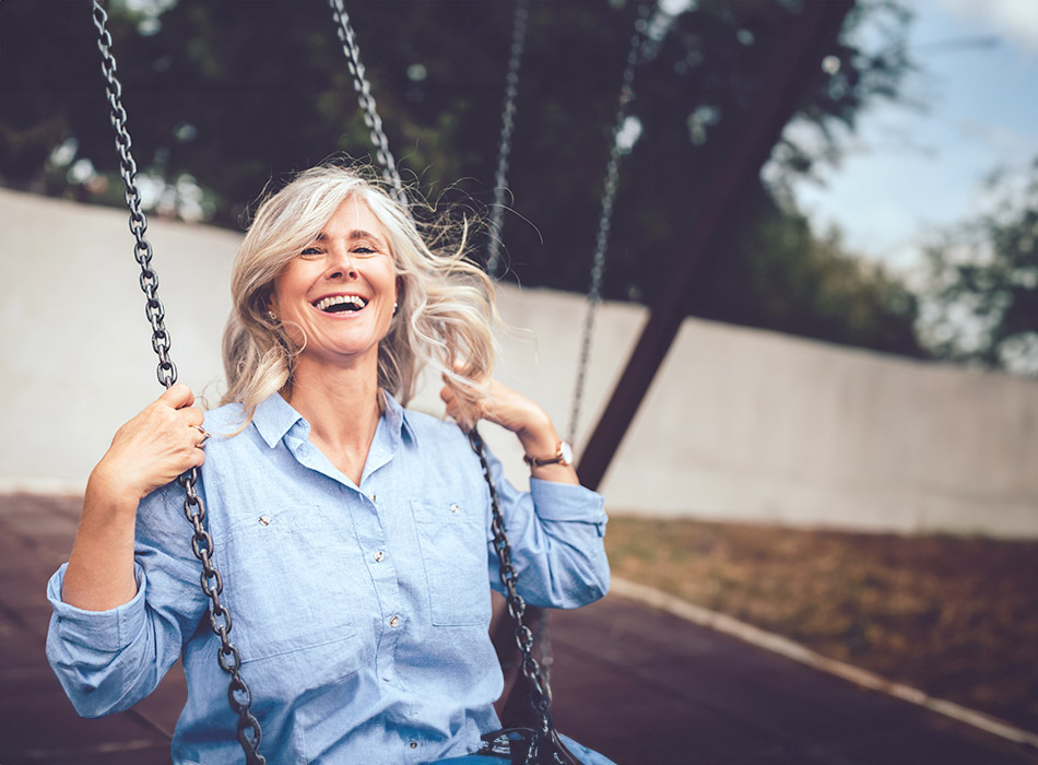 elderly woman on a swing